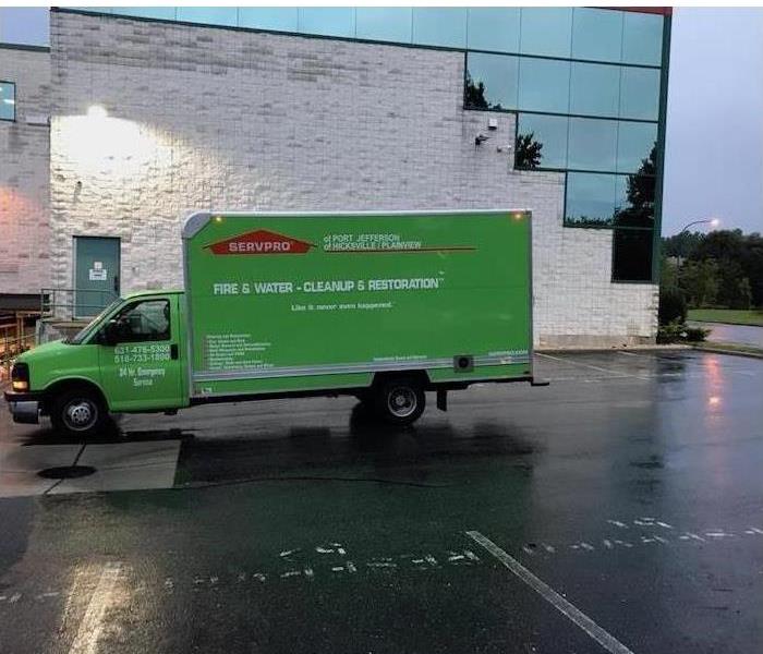 SERVPRO vehicle parked in front of commercial building